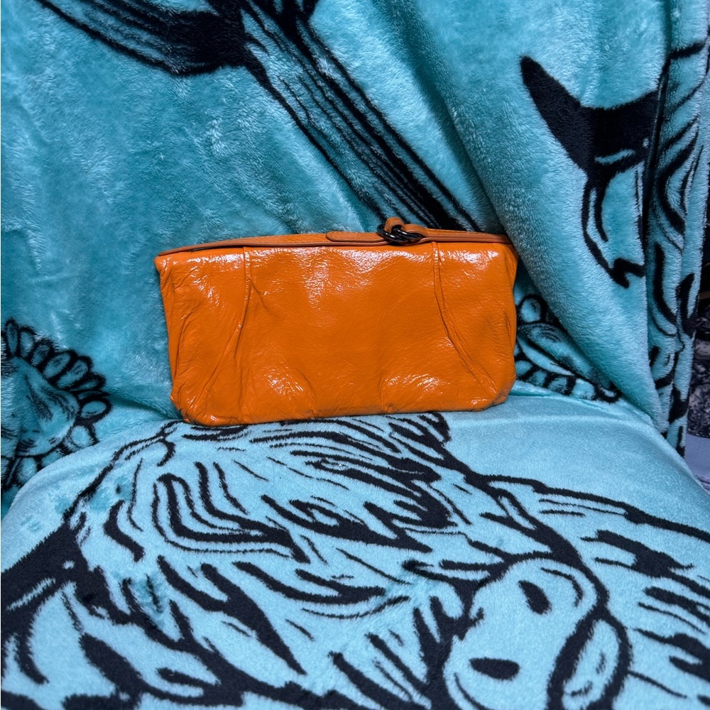 HOBO Orange Patent Leather Zip Clutch
